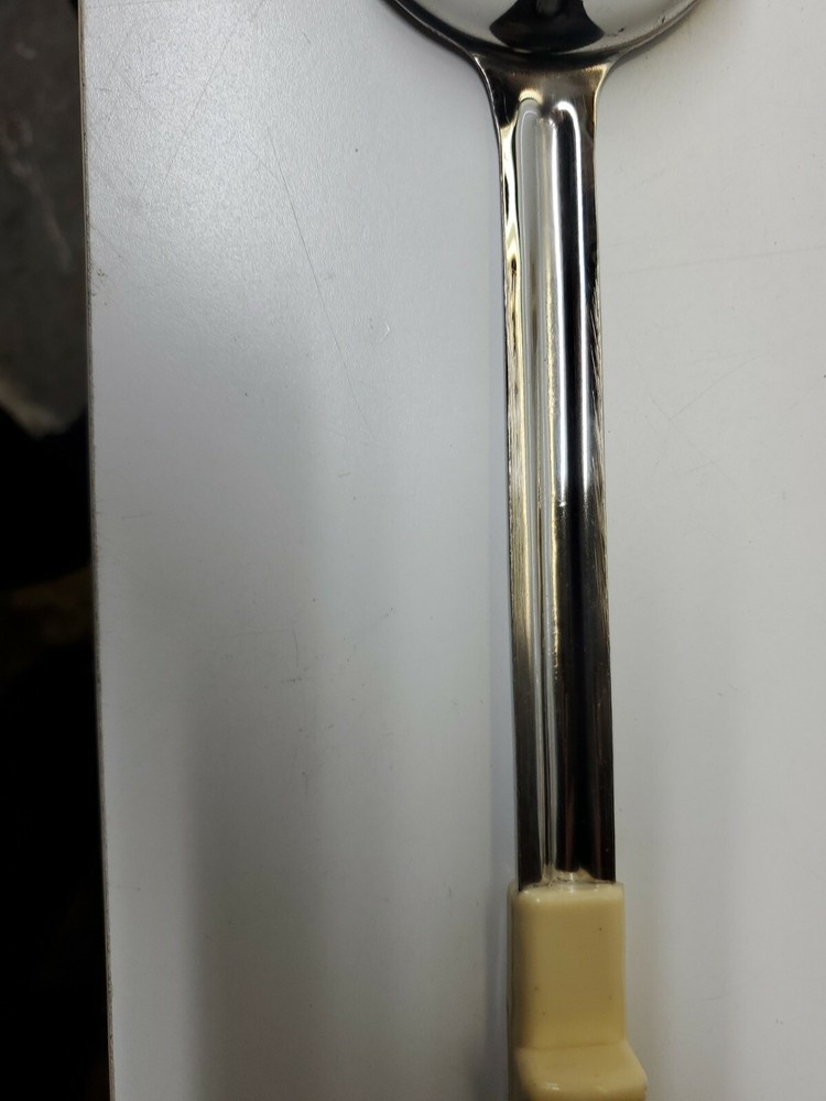 Winco - FPS-3 - 3 oz Beige Solid Portion Spoon