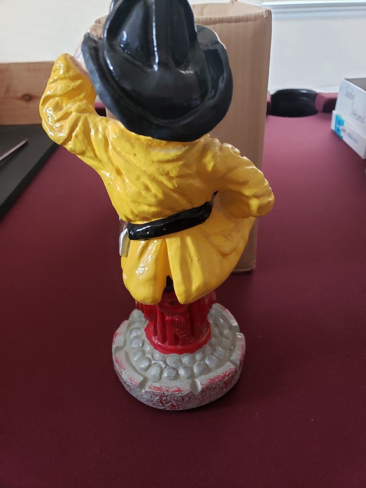 Vintage Fireman Chief #7 sitting on fire hydrant 12" chalkware.