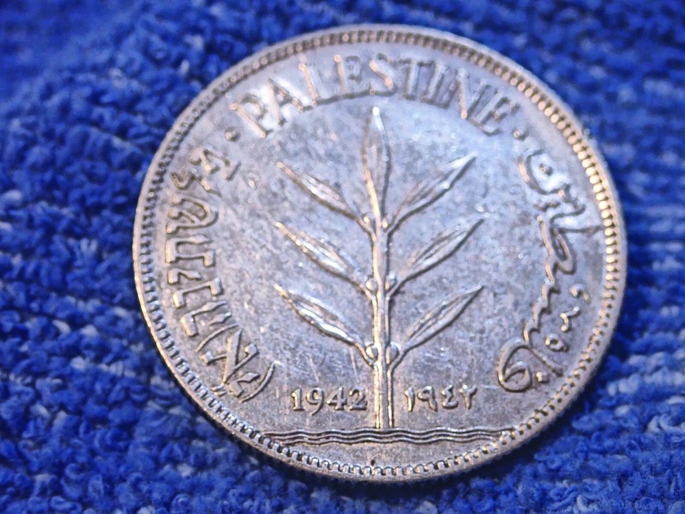 PALESTINE: 1942 SCARCE SILVER 100 MILS IN ABOUT UNCIRCULATED CONDITION!
