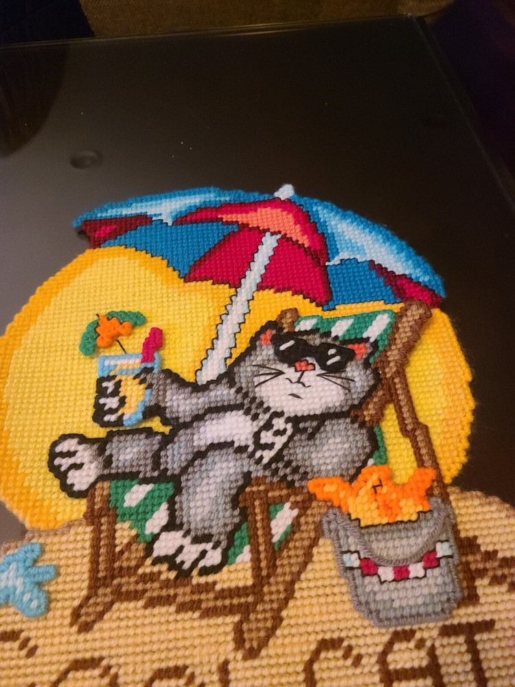 Cross stitch cat at beach on plastic canvas. 3D.
