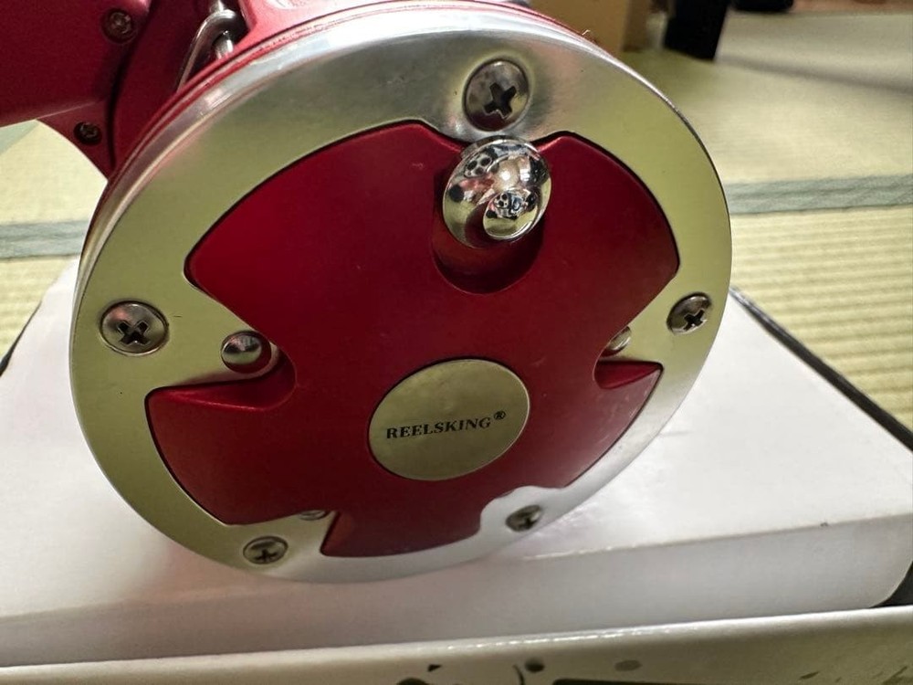 Unused bait reel with depth counter red