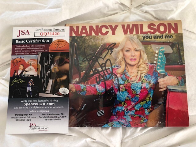 NANCY WILSON (HEART)  SIGNED CD COVER (COA BY JSA)