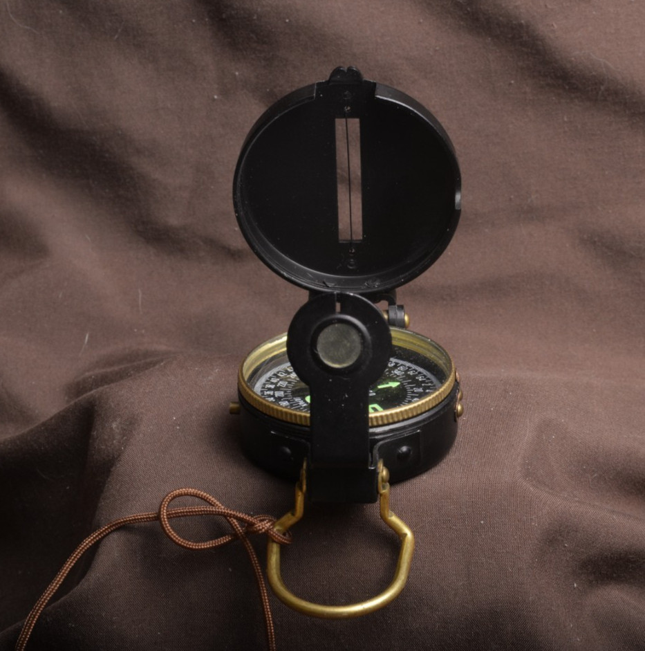 two lensatic compasses one with box