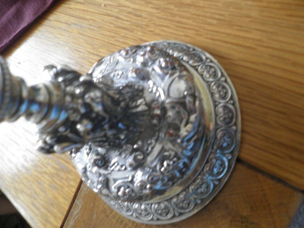 Elkington & co silver plate candlestick ,ORNATE DECORATION.14CMS HIGH.9CMS BASE