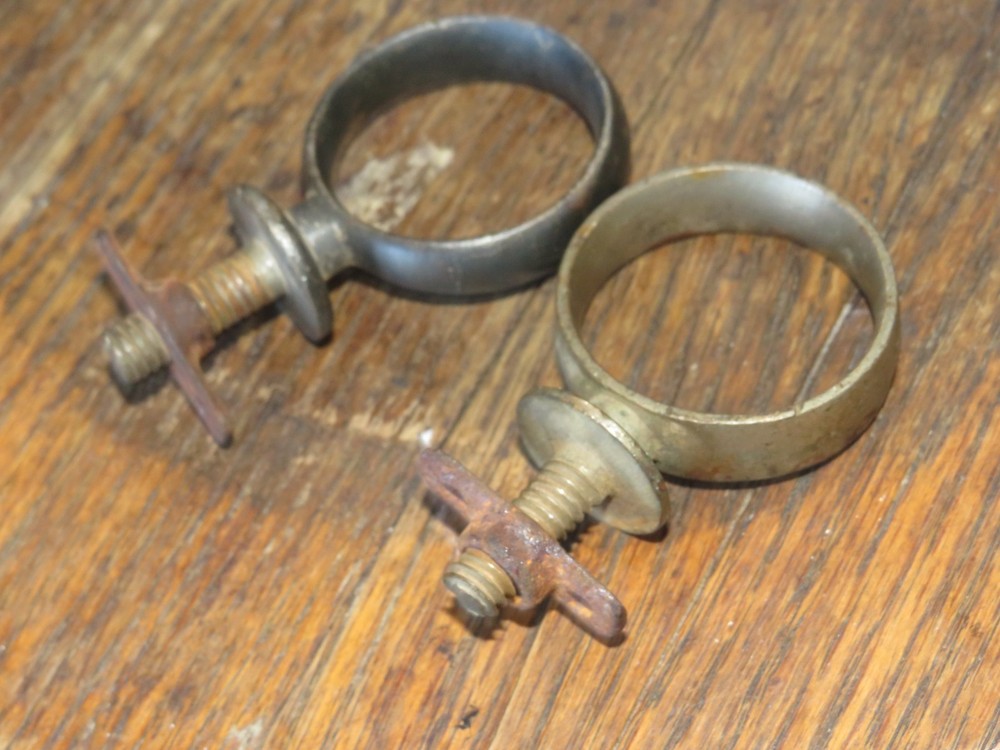 Two Antique Primitive Metal Ring Band Pipe Brackets