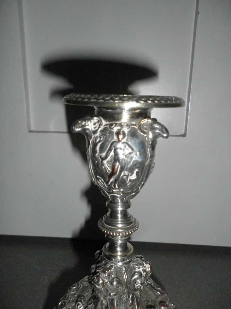Elkington & co silver plate candlestick ,ORNATE DECORATION.14CMS HIGH.9CMS BASE