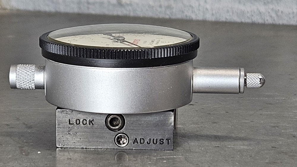 Starrett No. 25-111 dial indicator with No. 674-2 adjustable mounting bracket