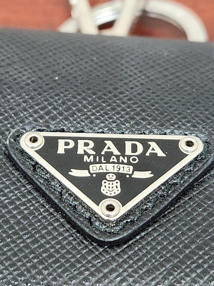 PRADA AirPods case, with triangular logo and Saffiano leather