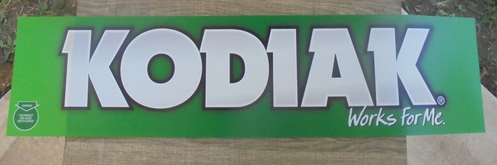 KODIAK-WORKS FOR ME- THIN PLASTIC SIGN  34X8.5"