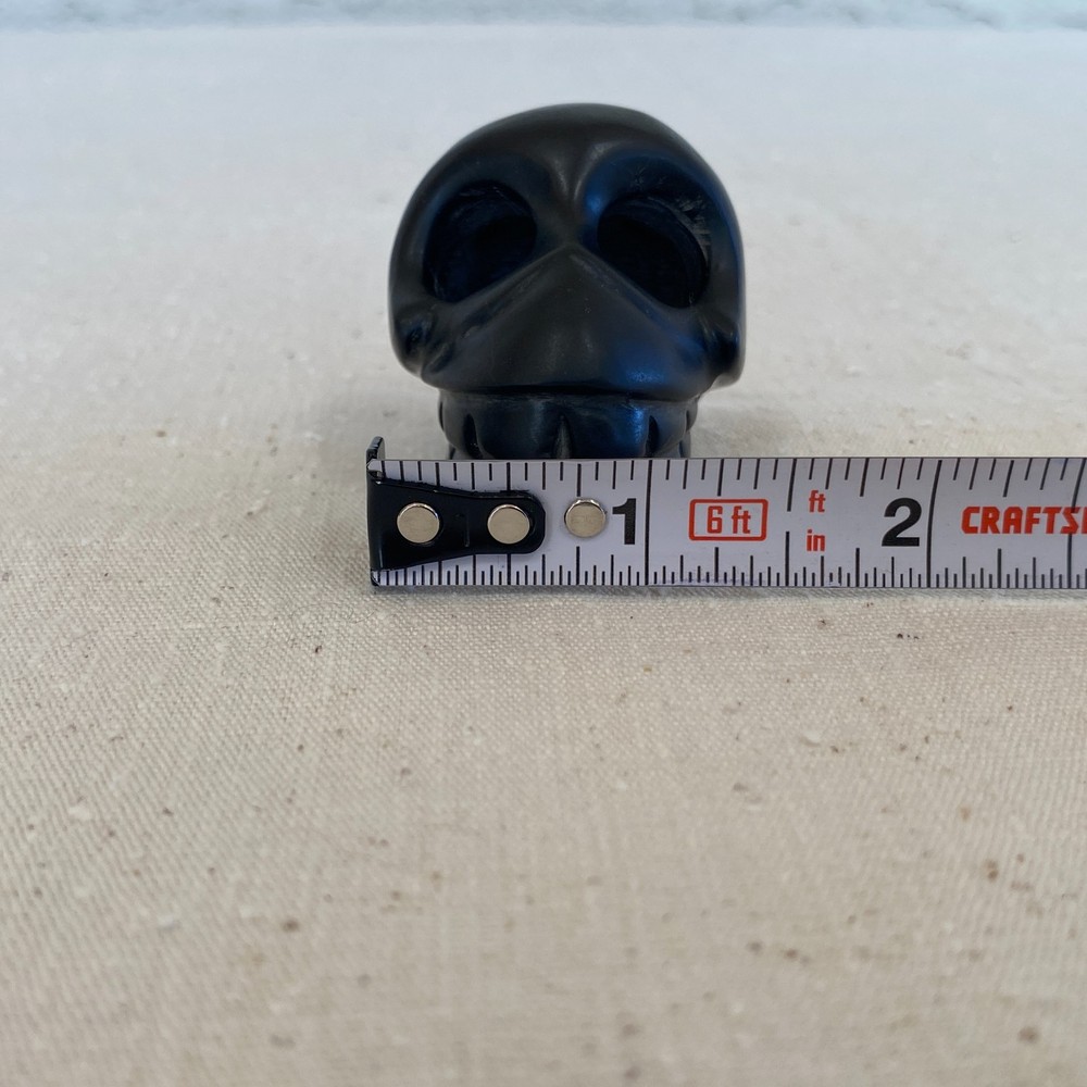 Stylized Carved Stone Skull Pendant