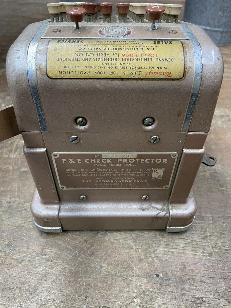 Vintage F & E Check Protector The Hedman Company