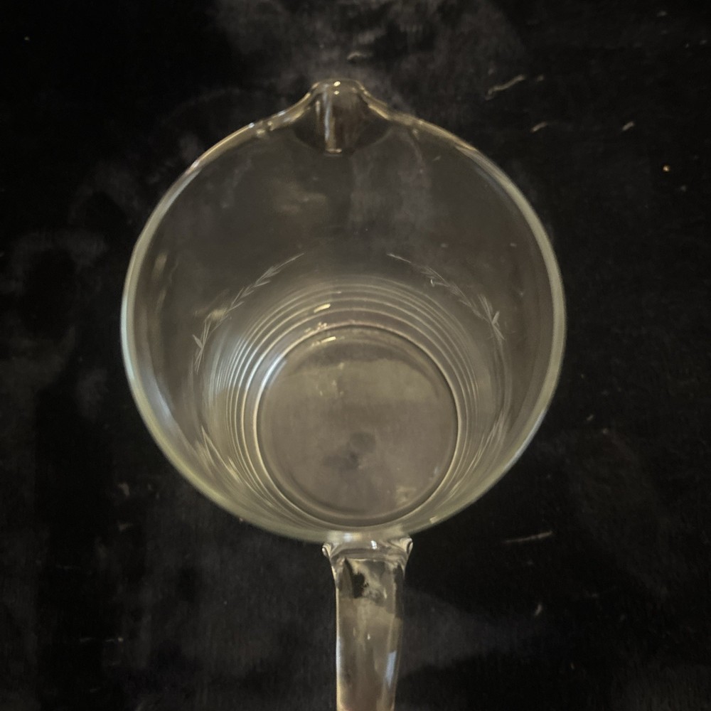 This is a vintage etched glass pitcher with a wheat pattern.