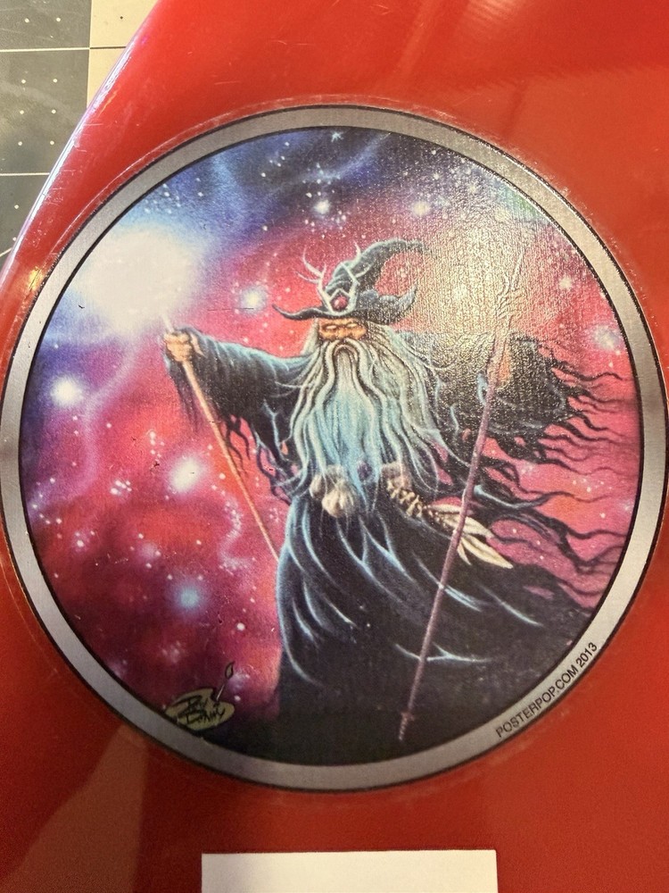 Red Surfboard Fin with Wizard Graphic