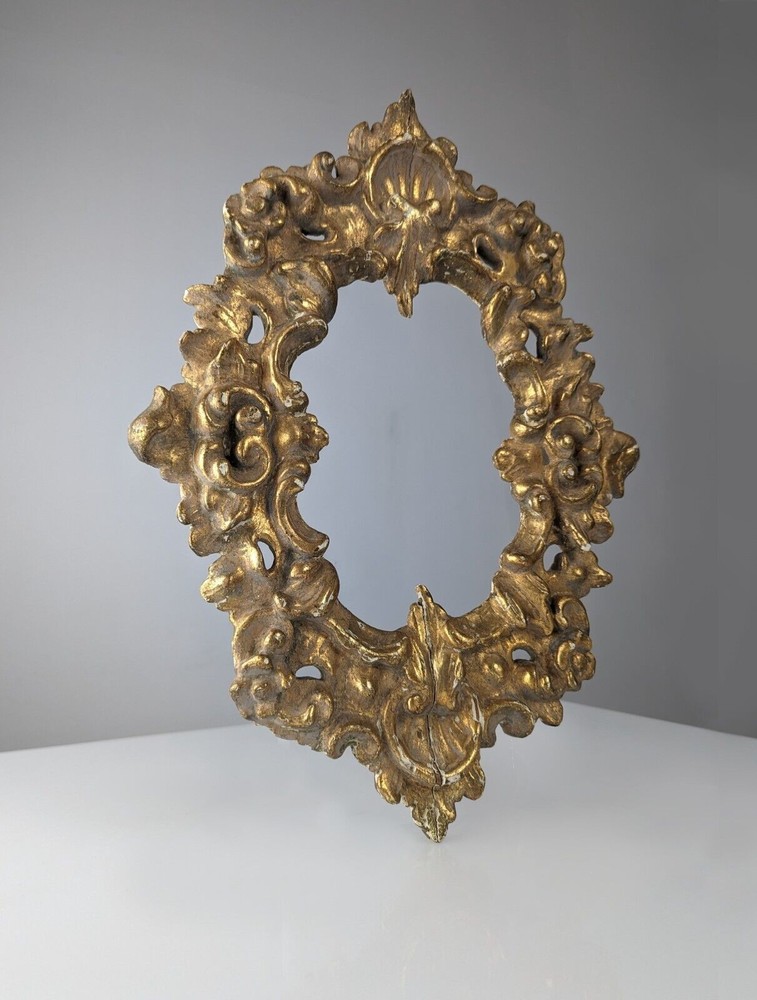 Antique gilt stuccoed wood frame