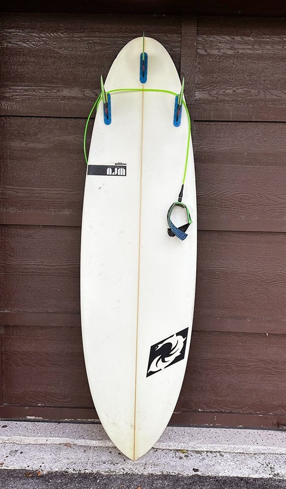 YANCER Surfboard and a cover