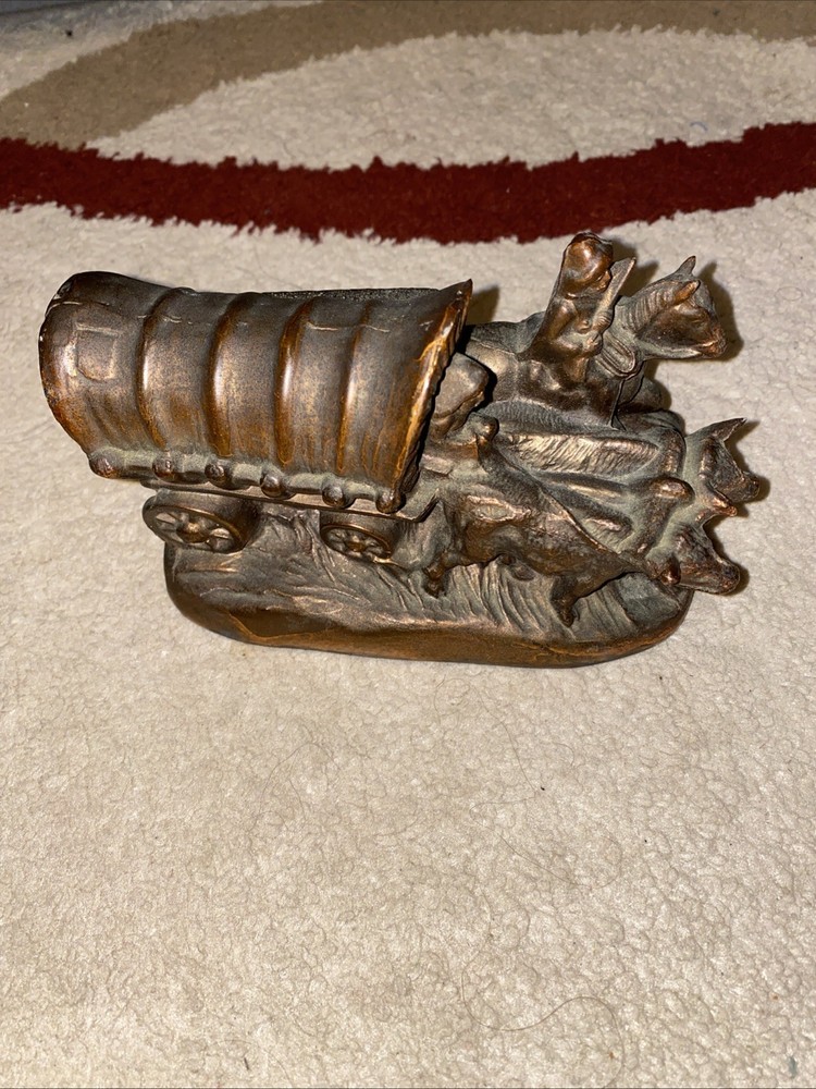 OLD COVERED WAGON PULLED BY OXEN WITH SOLDIERS