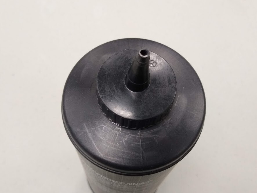 Vintage OEM John Deere powdered graphite empty plastic bottle B33379
