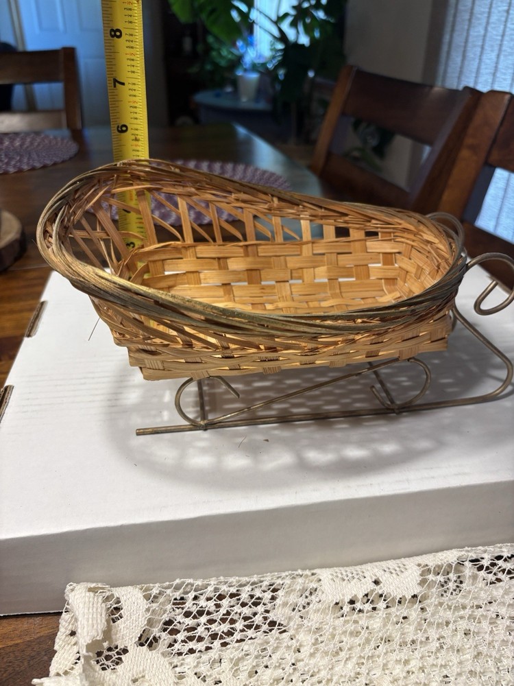 Wicker sleigh basket and white Doily