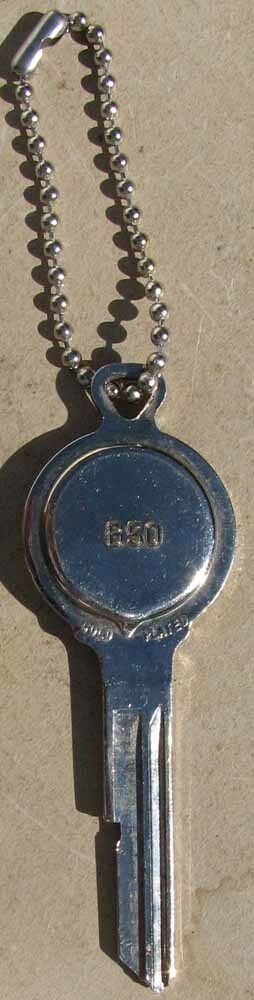 NOS CADILLAC LOGO KEY UNCUT PRISTINE CONDITION #H531