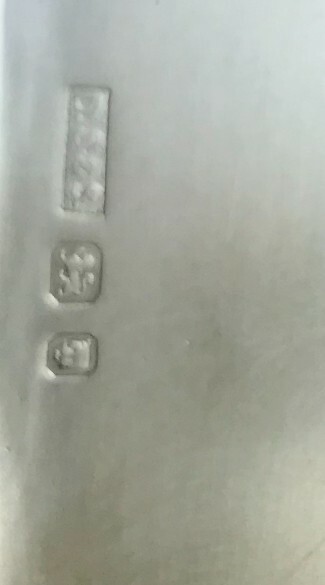 Hallmarked silver compact case with a leather cover