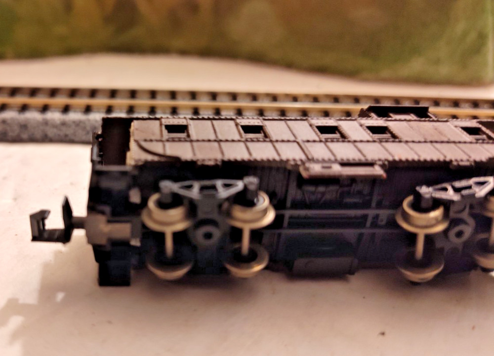 N Scale unmarked 5 window brown cupola caboose