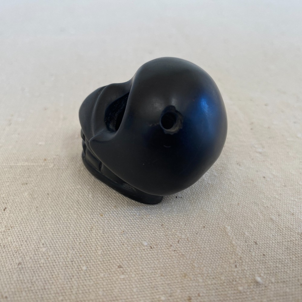 Stylized Carved Stone Skull Pendant