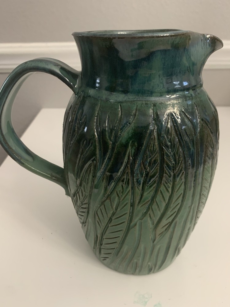 Signed Handcrafted Pottery Pitcher W/ Teal Green Glaze & Raised Leaf Pattern