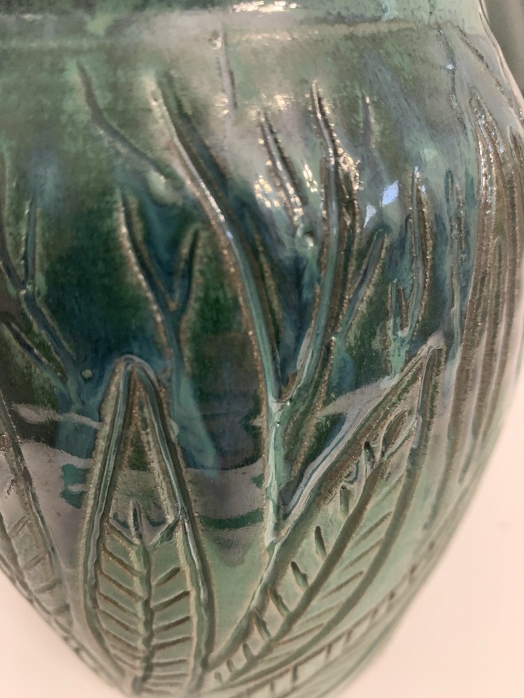 Signed Handcrafted Pottery Pitcher W/ Teal Green Glaze & Raised Leaf Pattern