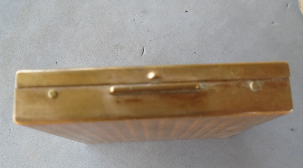 vintage compact with Merchant Marine pin on front