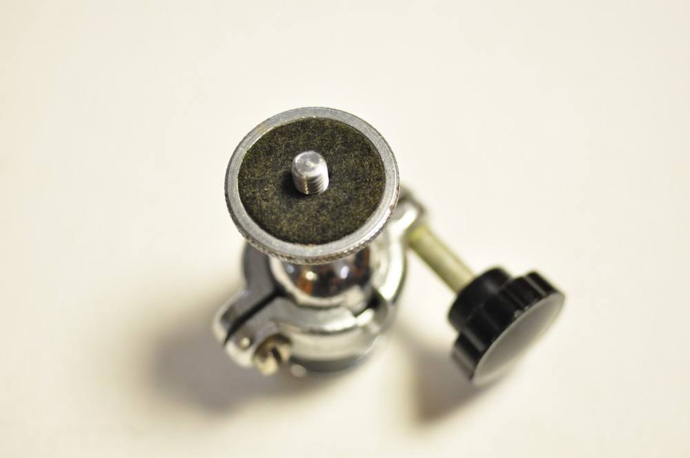 2 1/4" tall ballhead with 1/4" thread at both ends. Well made.