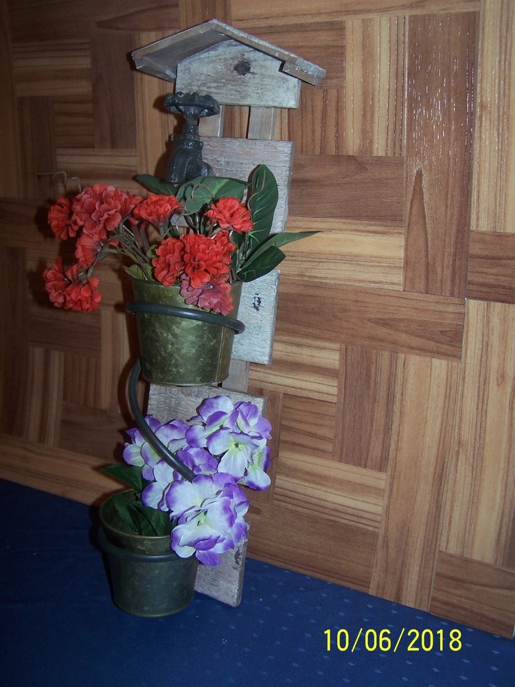 Rustic Looking Double Wall Planter featuring 2 planters and decorative faucet