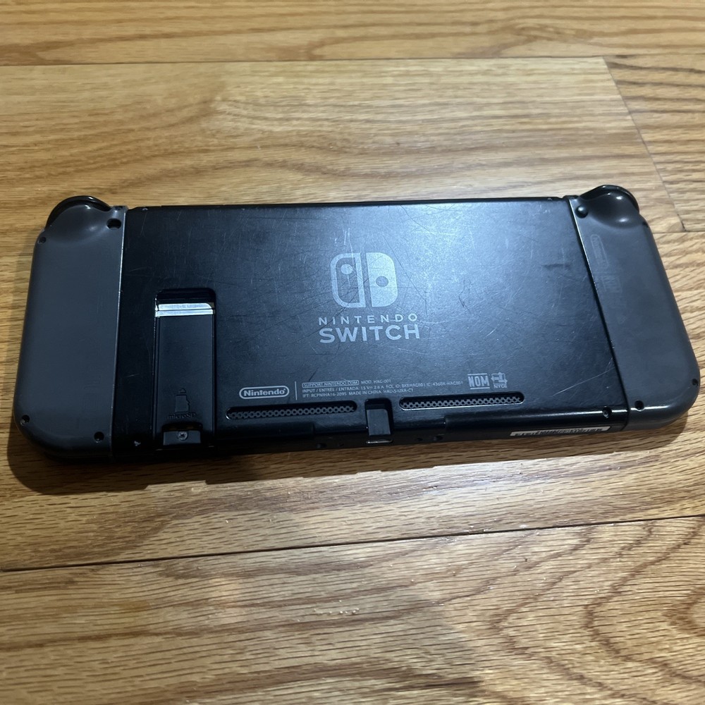 Nintendo Switch Console W/ Dock, Joycon Grip, & Joycons “READ”
