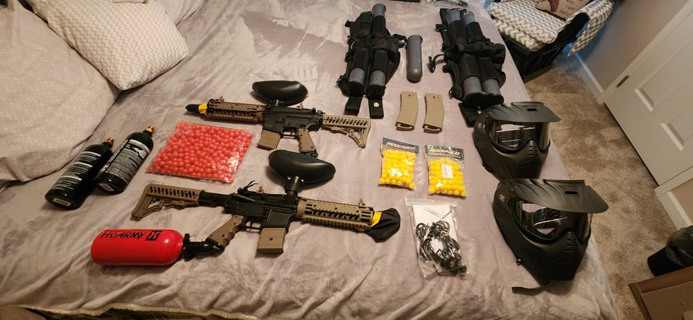 2 paintball guns with accessories