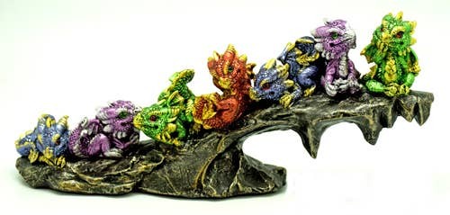 7 Baby Dragons on Rock