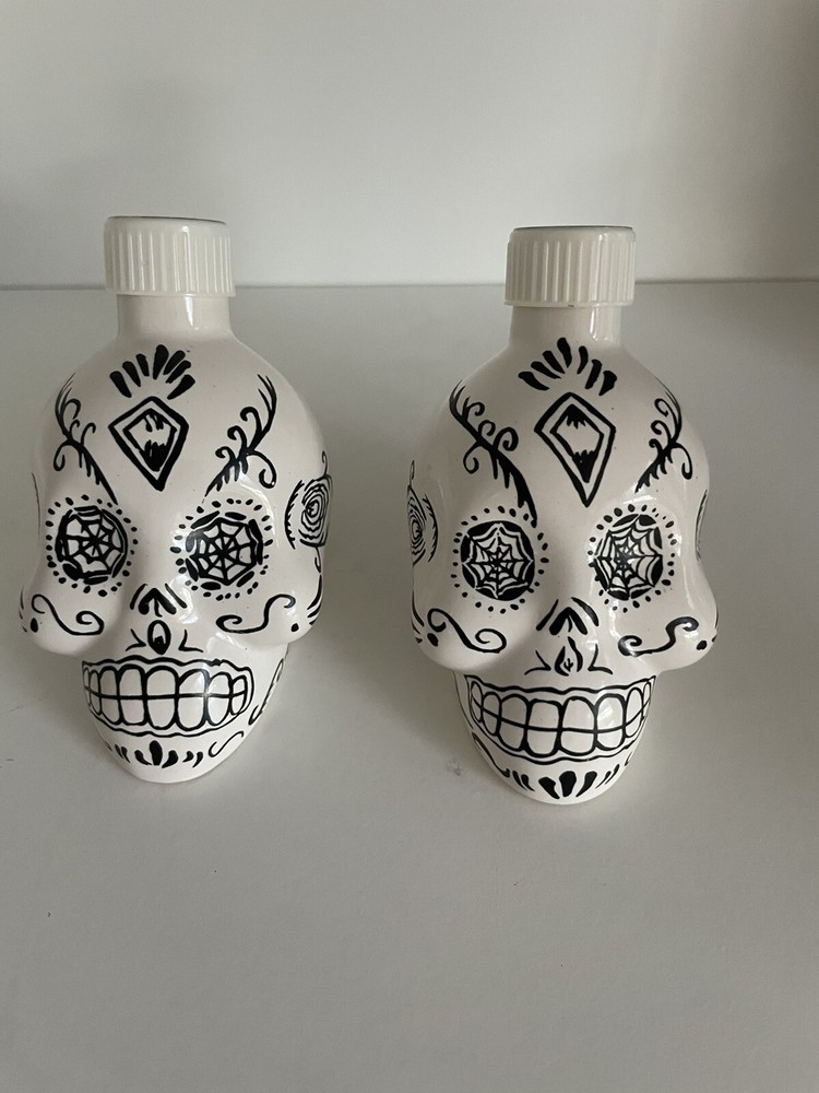 Empty 2 Sets of Kah Tequila White and Black Skull Containers