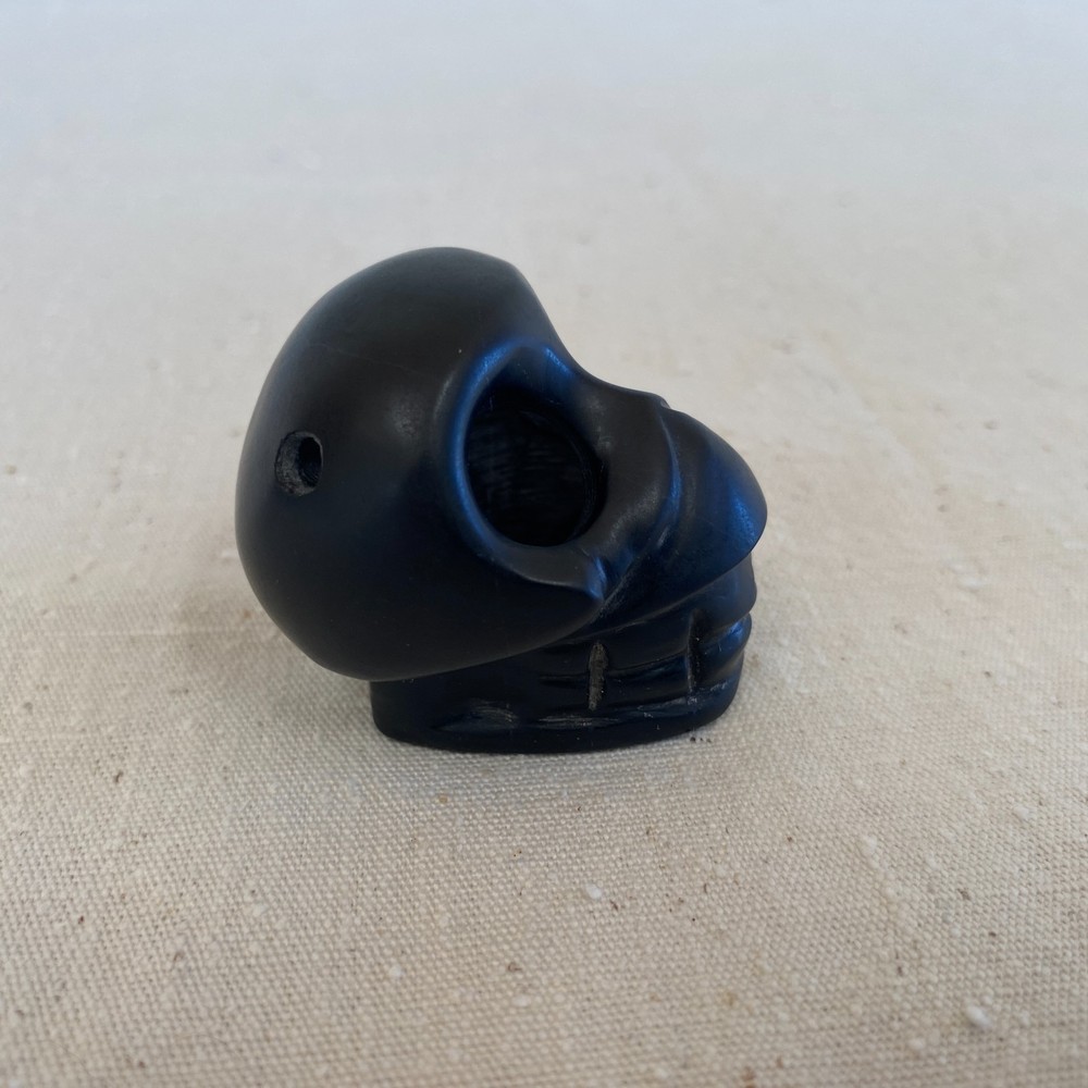 Stylized Carved Stone Skull Pendant