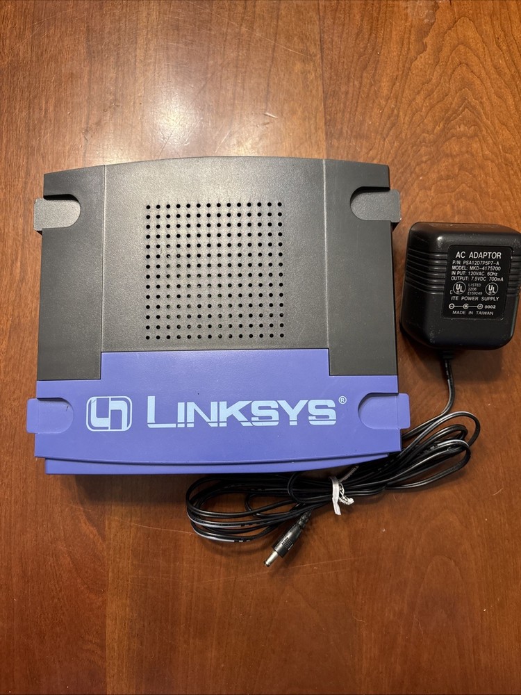 Linksys EtherFast 100 Mbps 1-Port 10/100 EtherFast Router (BEFSR11) + Adaptor