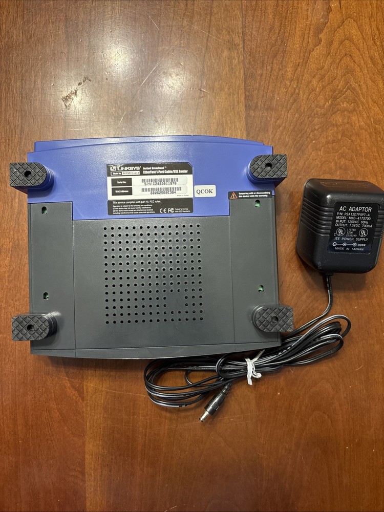 Linksys EtherFast 100 Mbps 1-Port 10/100 EtherFast Router (BEFSR11) + Adaptor