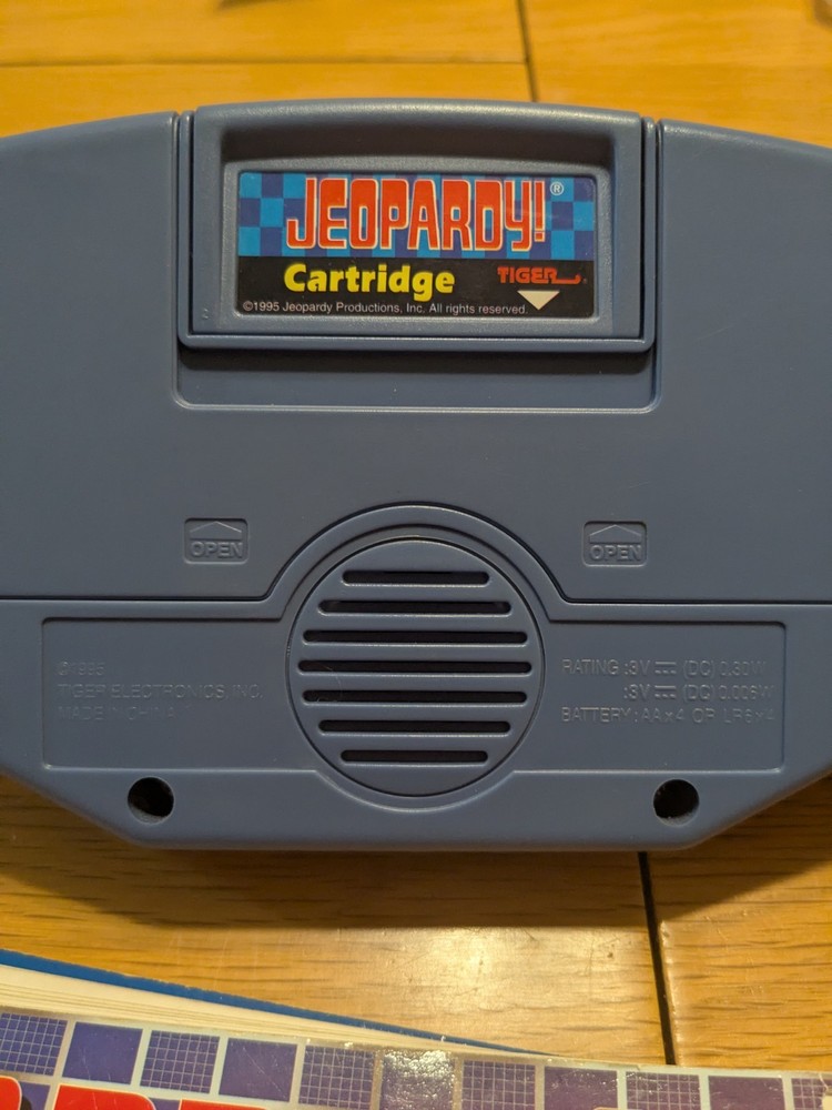 Tiger Electronics Jeopardy Hand Held Game 1995 with Answer Question Book