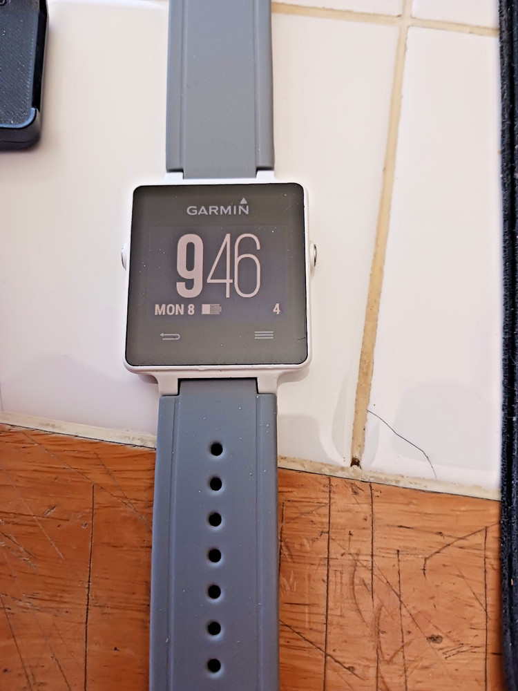 Garmin Vivactive Smart Watch, charger, and covers