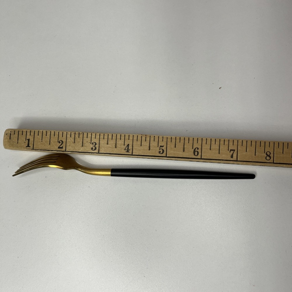 Gold Tone Fork With Matte Black Rounded Handle Modern And Elegant