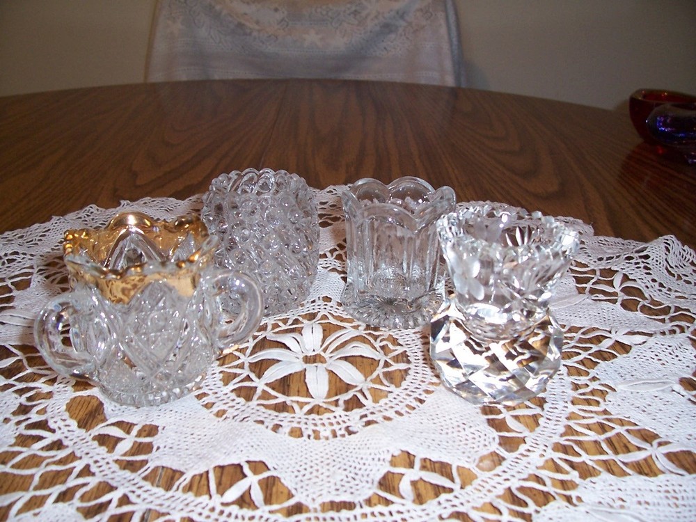 FOUR NICE GLASS TOOOTHPICK HOLDERS