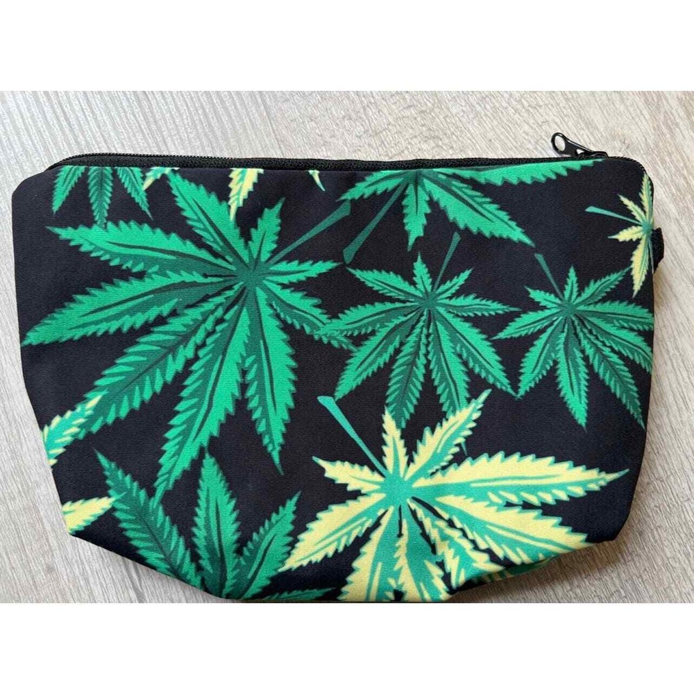 Leaf cosmetic bag with keychain and scrunchie.