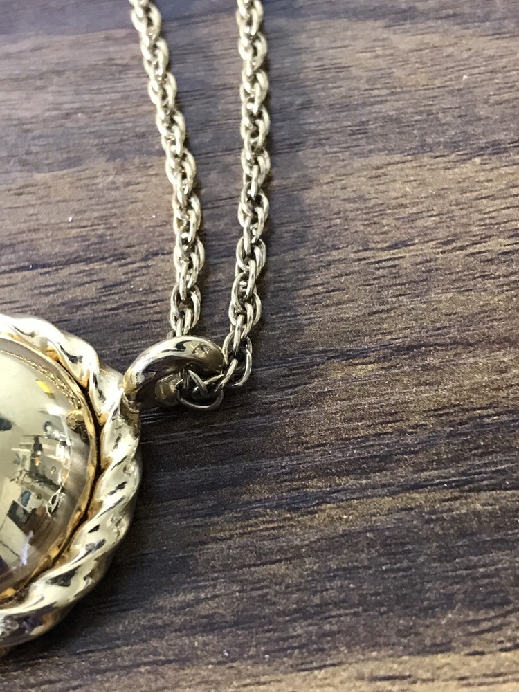 Monet Gold tone Necklace with round Pattern Pendant