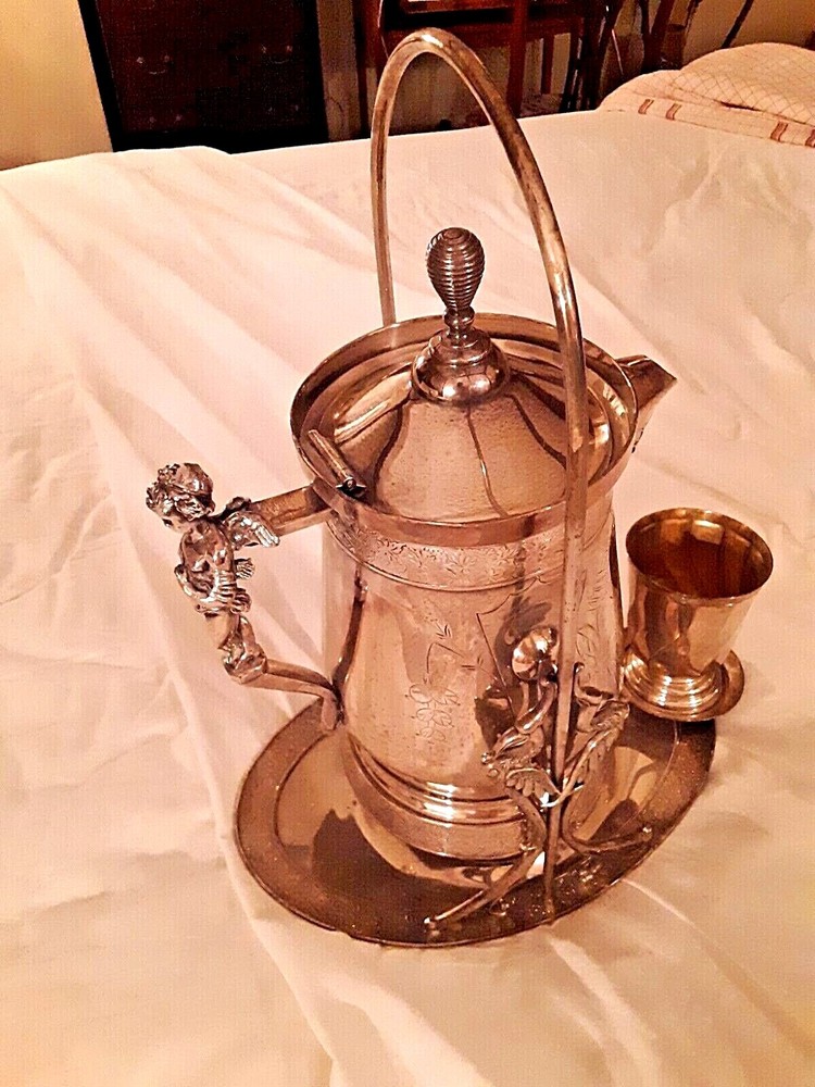 Wilcox Silver Plating Co. c.1870 Tilting Water Pitcher W/Cherub & Storks
