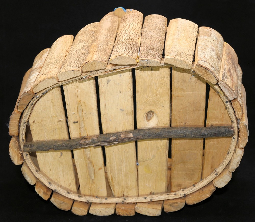 medium-sized oval storage basket features a wood fish handle