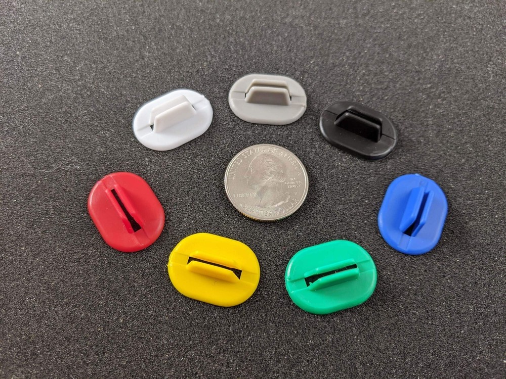 Flexible plastic stands for board game pieces