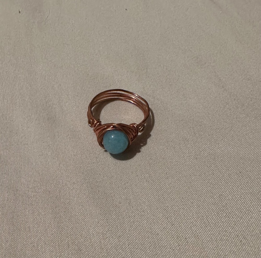set of three rings, 2 gemstone, 1 wire, unknown specifics