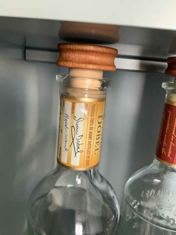 x2 Maestro Dobel reposado and anejo tequila empty bottles