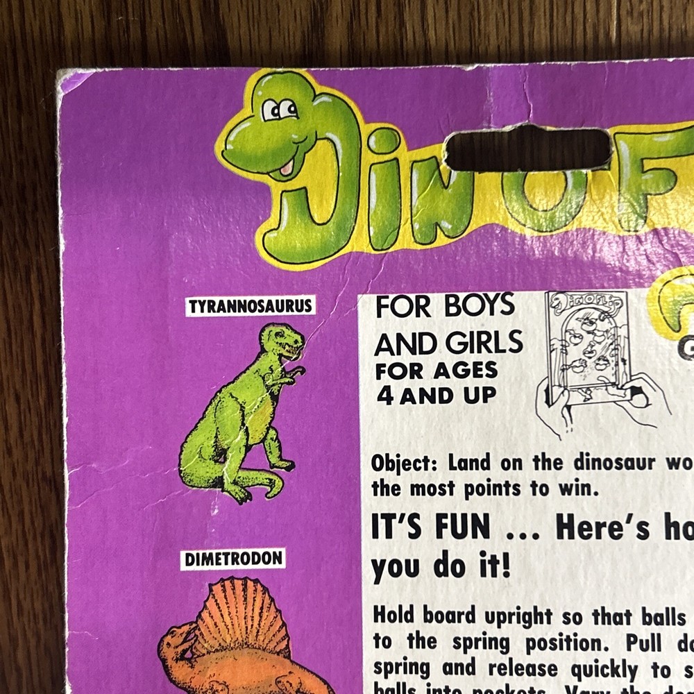 Vintage 1987 Din-o-Flip Handheld Game.